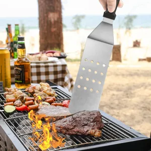 Stainless steel BBQ spatula with slotted blade for grilling steak outdoors
