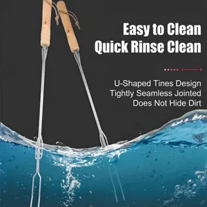 U-shaped stainless steel BBQ roasting forks with ergonomic wooden handles in water splash