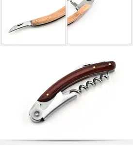 Detail showing the serrated foil cutter and folded rosewood waiter's friend corkscrew