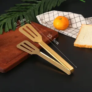 Detailed view of gold stainless steel food tongs with size markings 23.5cm by 5.5cm