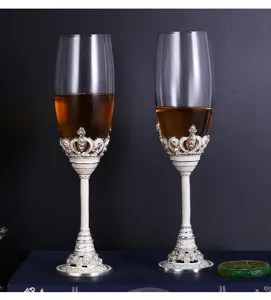 Exquisite enamel crystal glass champagne flutes with floral relief and pearl base detail