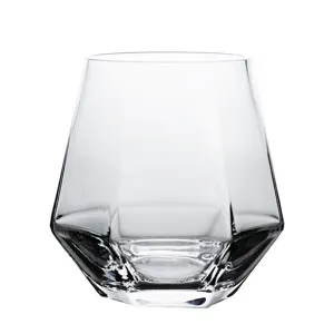 Elegant geometric clear glass tumbler for cocktails and juice on white background