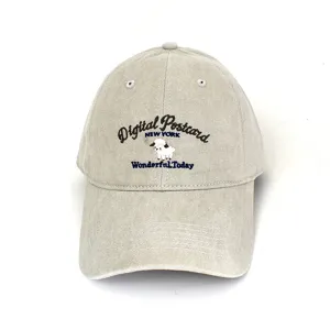 Macro detail view of a vintage stone-washed khaki baseball cap featuring cute sheep embroidery