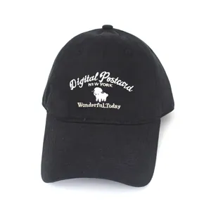 Detailed view of white cartoon sheep embroidery on black cotton baseball cap for women