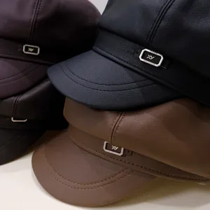 Close-up of the vintage PU leather texture and metallic accent on these newsboy hats