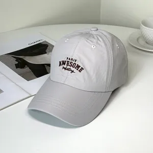 Close-up of quick-dry baseball cap with Paris Awesome letter embroidery