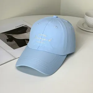 Detail of light blue quick-dry baseball cap with stylish white embroidery