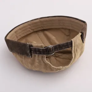 Detail view of a vintage washed canvas docker hat with adjustable metal buckle back.