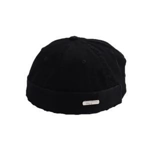 Minimalist black distressed Miki hat with metal plate detail for street fashion look