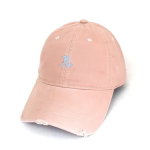 Distressed pink baseball cap featuring cute blue embroidered text 'Bye', casual sun protection.