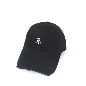 Black distressed baseball cap with white embroidered letter detail for casual streetwear styles.