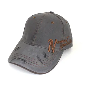 Vintage distressed baseball cap with brown side embroidery and classic curved brim style.