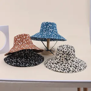 Outdoor floral print foldable bucket hats with large brims shown in multiple colors