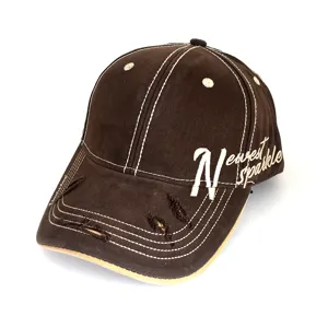 Distressed brown baseball cap with contrast white stitching and side letter embroidery.