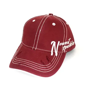 Detailed view of the dark red vintage baseball cap with white contrast stitching and embroidery.