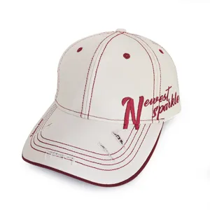 Close-up of vintage distressed baseball cap with side red embroidery and distinctive brim holes.