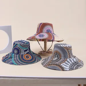 Detail of three printed wide-brim sun hats in various tribal patterns and colors