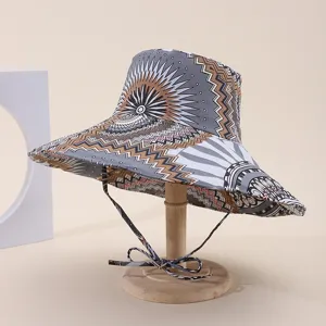 Side view of a wide-brim sun hat featuring tribal geometric patterns and a chin strap