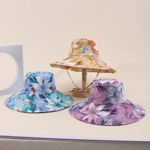 Set of three floral print wide-brim sun hats in various colors for outdoor protection