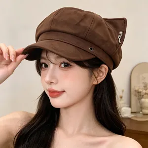 Brown suede cat ear newsboy hat for women, stylish autumn winter painter cap with key charm.