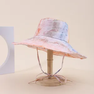 Wide-brimmed marble print sun hat with adjustable chin strap for outdoor sun protection