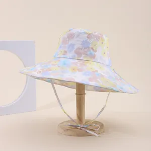 Detail view of the floral pattern and wide brim of this sun protection fisherman hat.