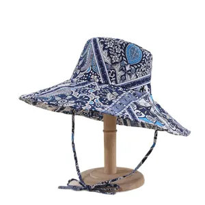 Foldable wide brim sun hat with blue paisley print for outdoor UV protection and travel