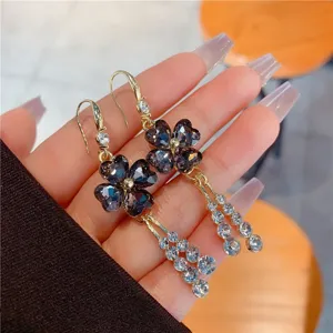 Sparkly rhinestone four-leaf flower drop earrings with elegant crystal tassels for women