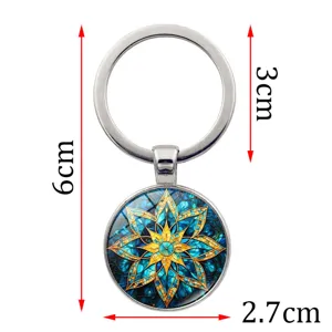 Detailed view of blue mandala keychain with 6cm total length and glass cabochon pendant