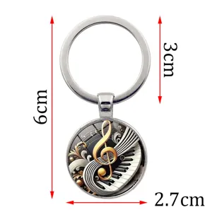 Detailed view showing dimensions of a piano and treble clef glass cabochon keychain