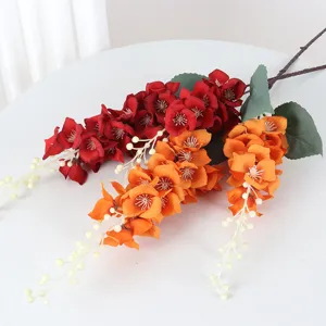 Artificial peacock orchid flower branches, red and orange silk floral for wedding decor.