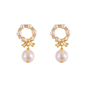 Elegant Korean style pearl earrings with gold bow detail and sparkling crystals for women