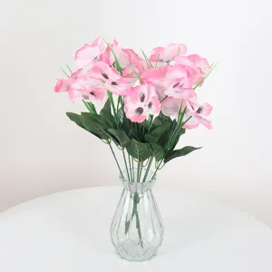 Realistic pink and white artificial pansy bouquet in a glass vase for elegant home decor