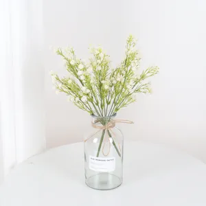 Artificial gypsophila bouquet with glass vase, lifelike soft rubber floral decor for home.