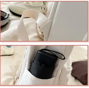 Close up view of white canvas student backpack strap and functional side pocket design.