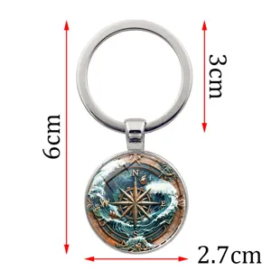 Detailed measurement view of a vintage nautical compass keychain featuring wave patterns