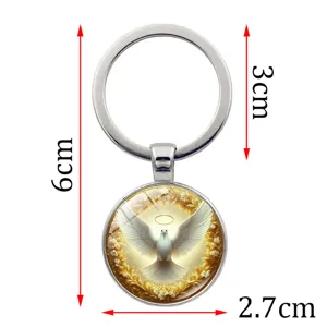 Close-up detail showing the 6cm total length of the holy spirit dove keychain pendant