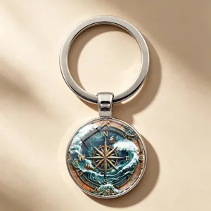 Detailed macro view of a vintage nautical compass keychain with sea waves illustration