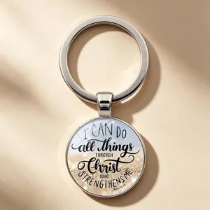 Close-up of inspirational silver-tone keychain with Philippians 4:13 Bible verse quote