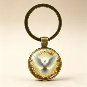 Detailed macro view of the white peace dove and halo design on a glass cabochon keychain