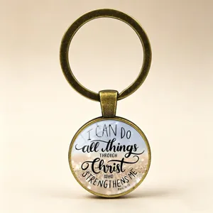 Close-up of glass cabochon keychain with Bible verse Philippians 4:13 text
