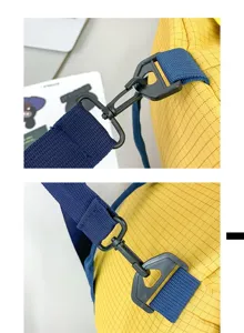 Close-up of durable metal hook and navy strap on yellow checkered camping storage bag