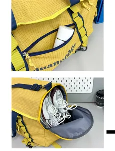 Detailed view of yellow camping storage bag with independent shoe compartment and front pocket