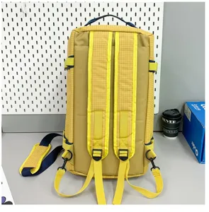 Detailed back view of a yellow large capacity camping storage bag with durable adjustable straps