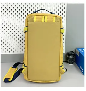 Back view of yellow large capacity camping storage bag with durable straps