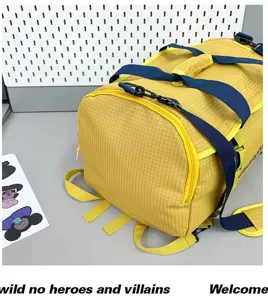 Close-up detail of yellow grid pattern outdoor travel bag with durable blue nylon straps