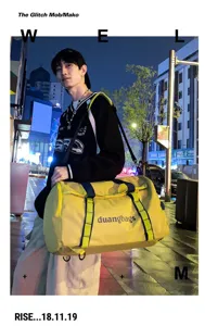 Outdoor urban night lifestyle view of a large yellow travel duffel bag