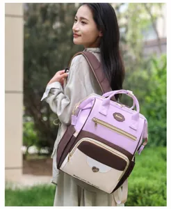 Sac à dos à langer multifonctionnel de grande capacité pour mamans élégantes et pratiques.