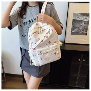 Mochila blanca con lazo rosa y lunares, elegante bolso escolar para mujeres uso diario