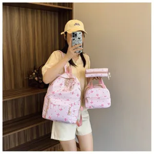 Conjunto de mochila de 3 piezas con estampado de lazo rosa para mujer estudiante viaje casual.
